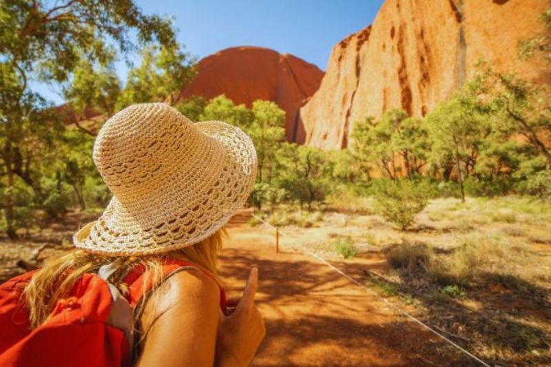 young person looking at view of a desert like terrain